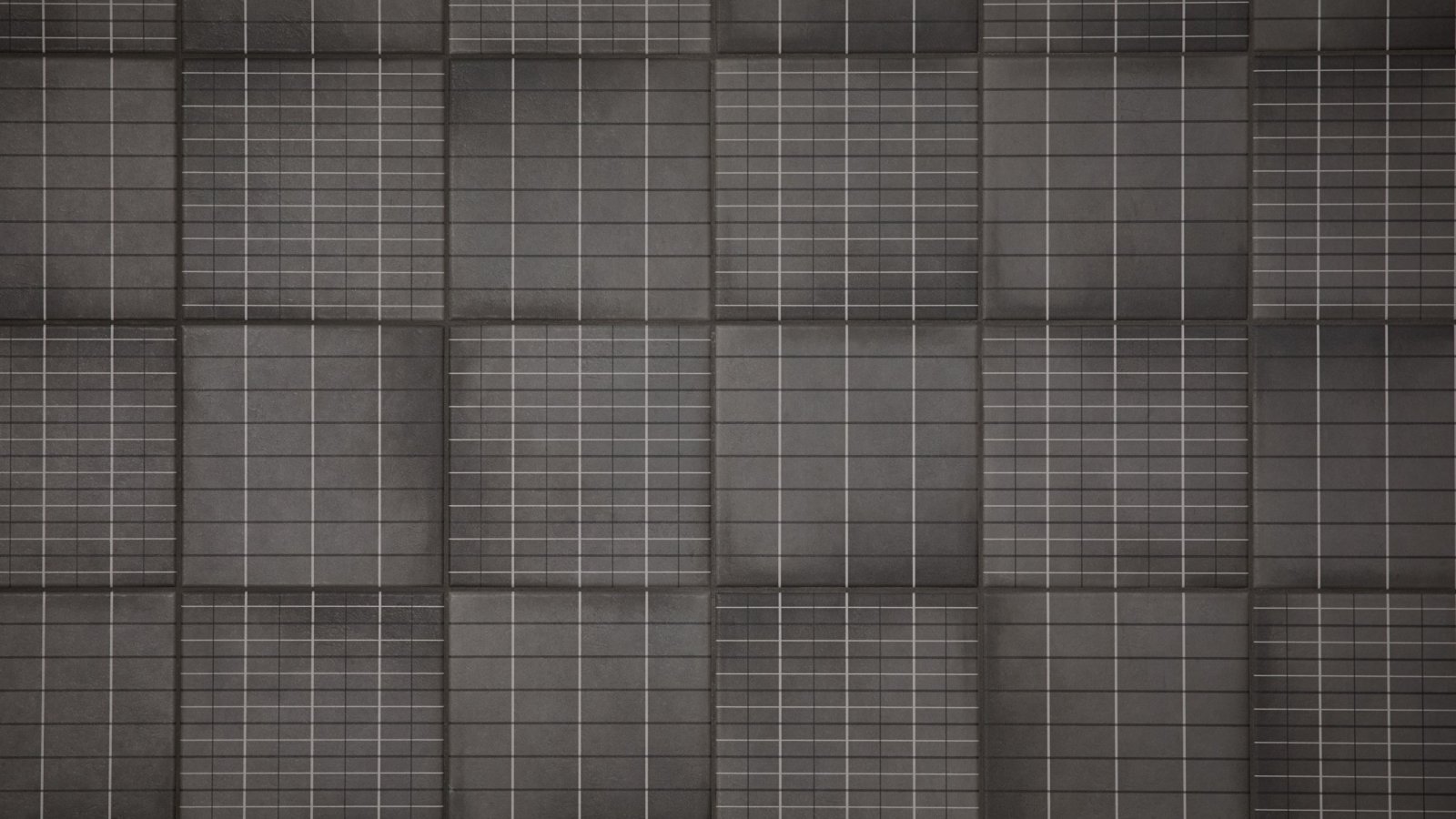 Mutina の Aurore Charcoal Grid L を張ったバスルームの壁